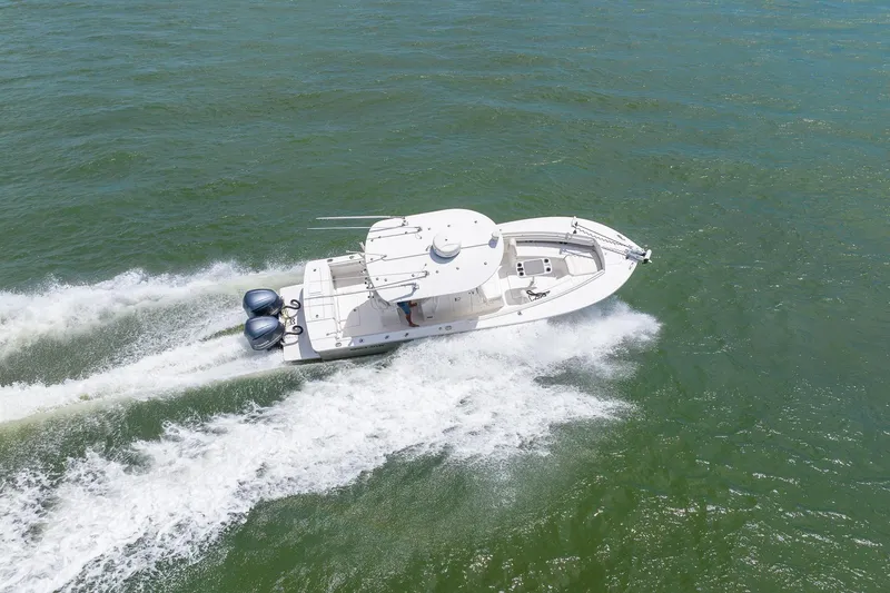 Slide: The Image of 2018 Regulator 28 boat cruising on open water, aerial view. - 34