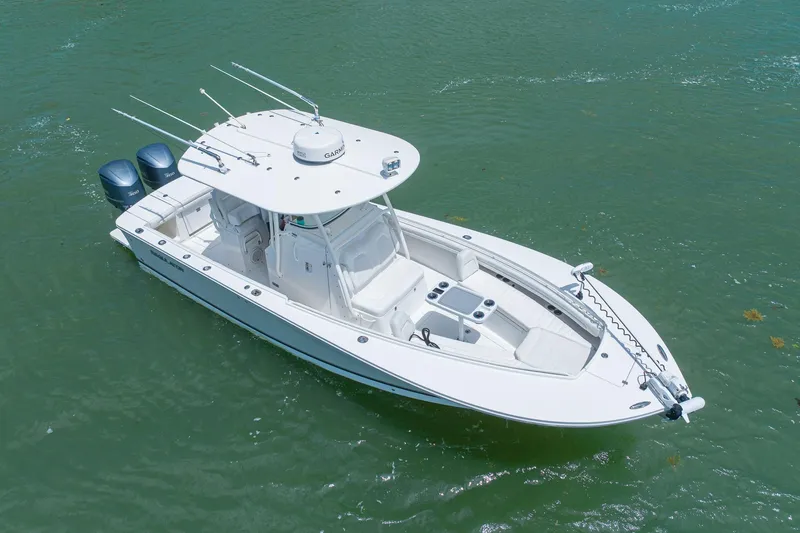 Slide: The Image of 2018 Regulator 28 boat with dual engines on calm water. - 4