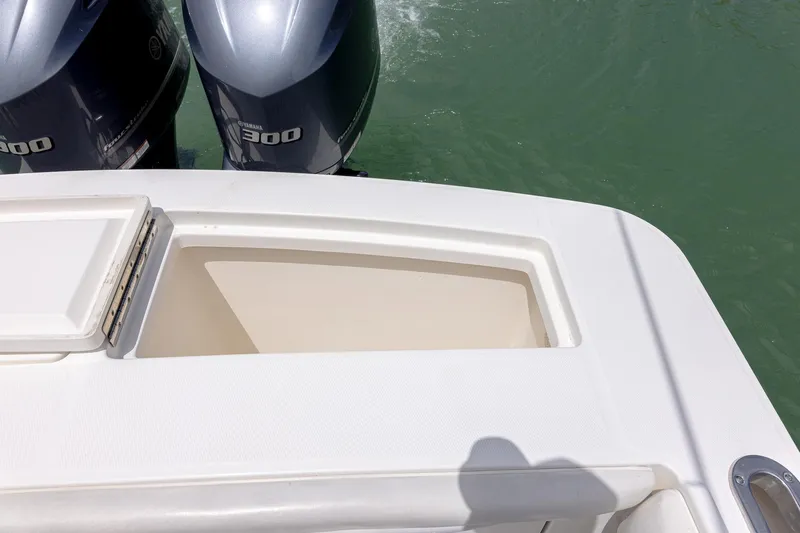 Slide: The Image of 2018 Regulator 28 boat with twin 300 horsepower engines on water. - 8