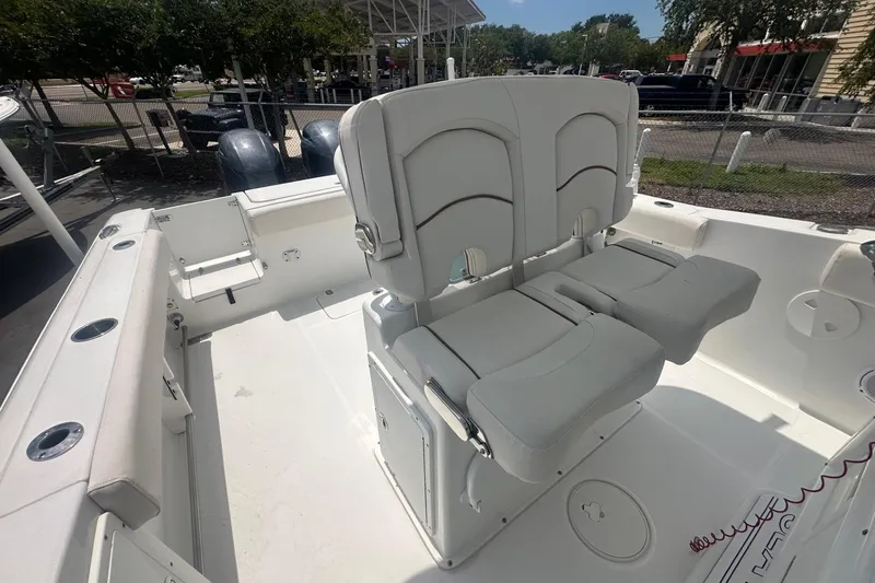 Slide: The Image of 2019 Sea Hunt Gamefish 27 Coffin Box boat interior with dual seating and spacious deck. - 7