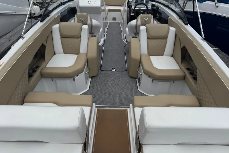 Slide: The Image of Interior of a 2015 Scarab 255 Platinum boat with beige and white seating. - 4