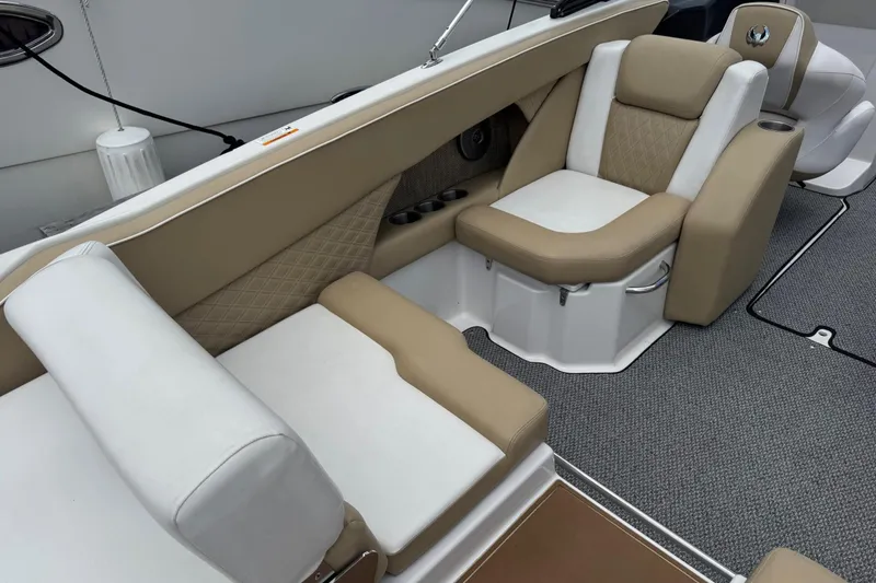 Slide: The Image of Luxurious seating in a 2015 Scarab 255 Platinum boat, featuring beige and white upholstery. - 5
