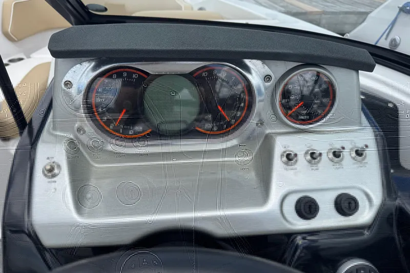 Slide: The Image of Dashboard of a 2015 Scarab 255 Platinum boat with gauges and controls. - 8