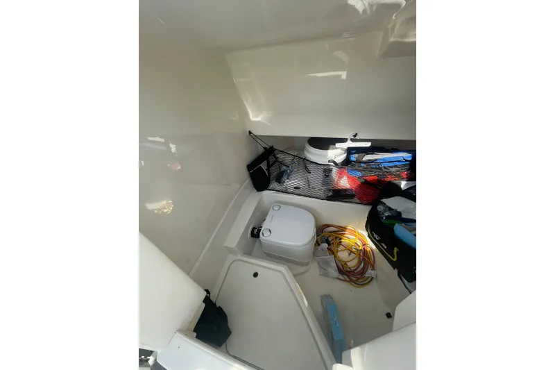Slide: The Image of Interior storage area of 2019 Sea Ray SDX 250 boat with equipment and supplies. - 22