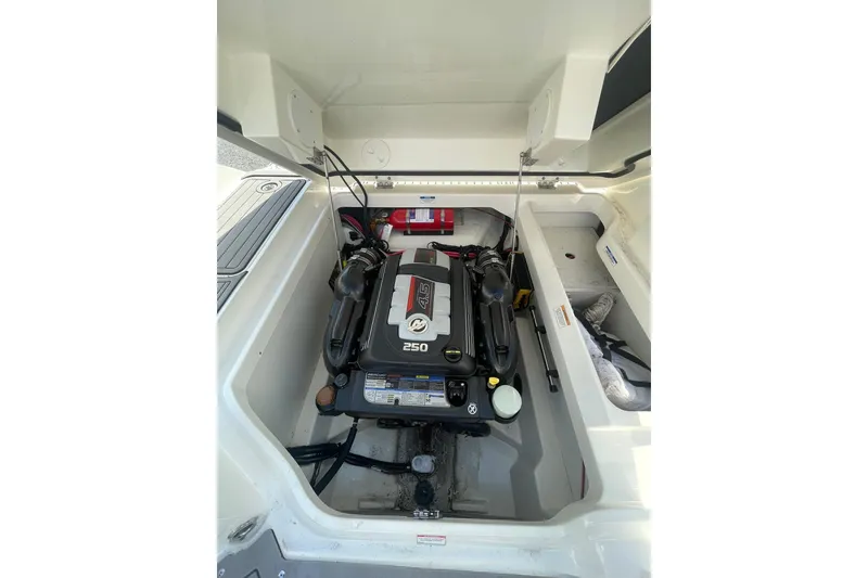 Slide: The Image of Engine compartment of a 2019 Sea Ray SDX 250 boat, showcasing the 4.5L engine. - 23