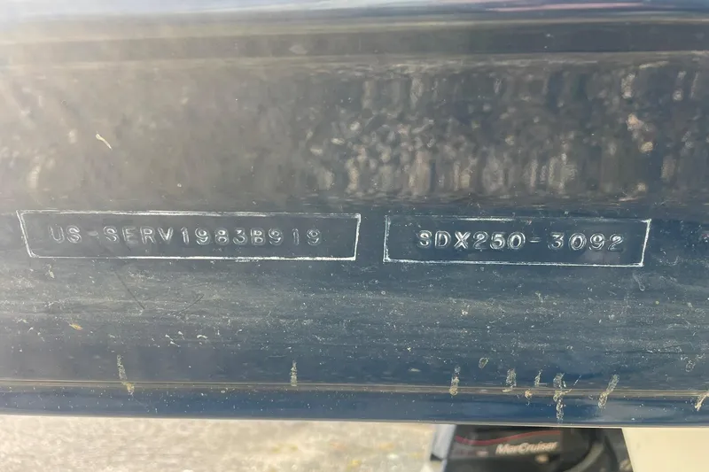 Slide: The Image of 2019 Sea Ray SDX 250 hull identification number on dark surface. - 24