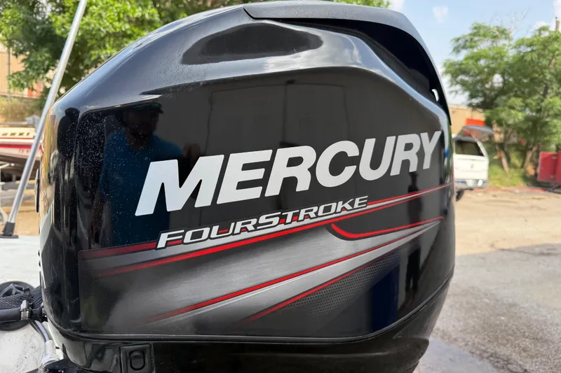 Slide: The Image of Mercury FourStroke engine on a 2016 Stratos 176 VLO boat, outdoors. - 13