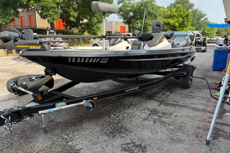 Slide: The Image of 2016 Stratos 176 VLO boat on trailer, featuring Minn Kota trolling motor. - 15