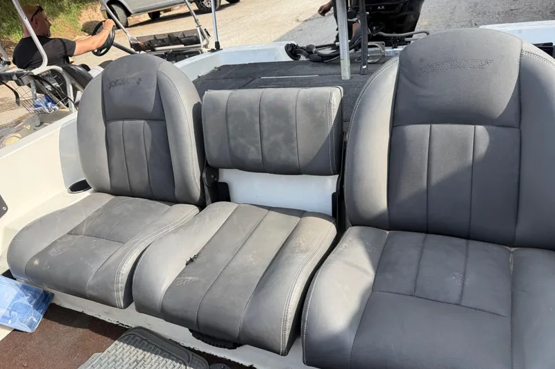 Slide: The Image of 2016 Stratos 176 VLO boat seats, gray upholstery, showing wear and tear. - 17