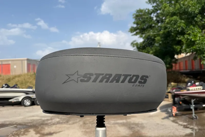Slide: The Image of Stratos 176 VLO 2016 boat seat with logo, outdoor setting, clear sky background. - 23