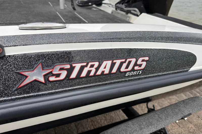 Slide: The Image of 2016 Stratos 176 VLO boat interior with VLO branding, featuring sleek design and storage compartments. - 33