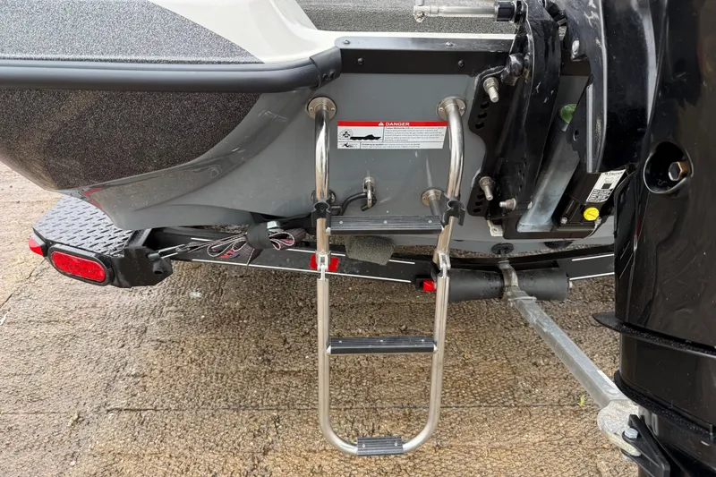 Slide: The Image of Rear view of a 2016 Stratos 176 VLO boat on a trailer with safety straps. - 36