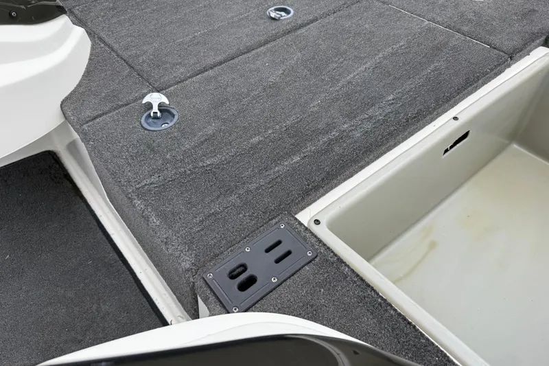 Slide: The Image of Open storage compartment in 2016 Stratos 176 VLO boat, featuring carpeted interior. - 39