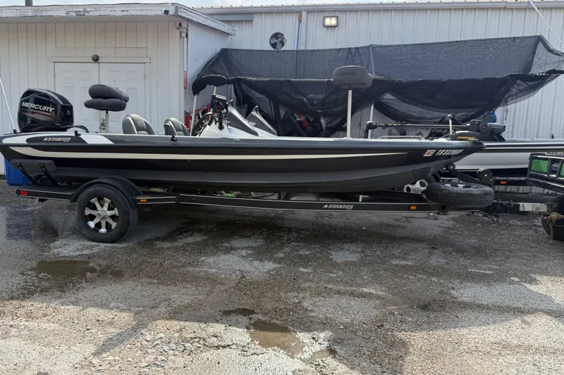 Slide: The Image of 2016 Stratos 176 VLO fishing boat on trailer, parked outdoors. - 4