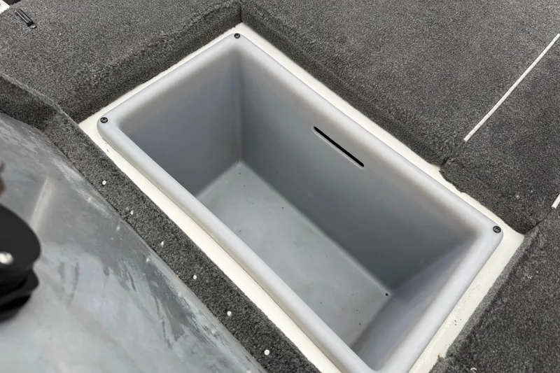 Slide: The Image of Open storage compartment in a 2016 Stratos 176 VLO boat. - 43