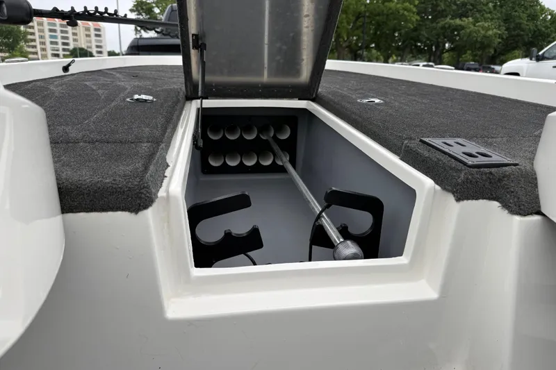 Slide: The Image of Open storage compartment in 2016 Stratos 176 VLO boat, featuring carpeted interior. - 45
