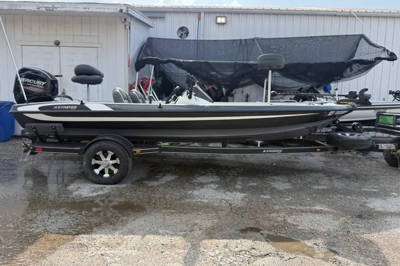 Slide: The Image of 2016 Stratos 176 VLO fishing boat on trailer, parked outdoors. - 5