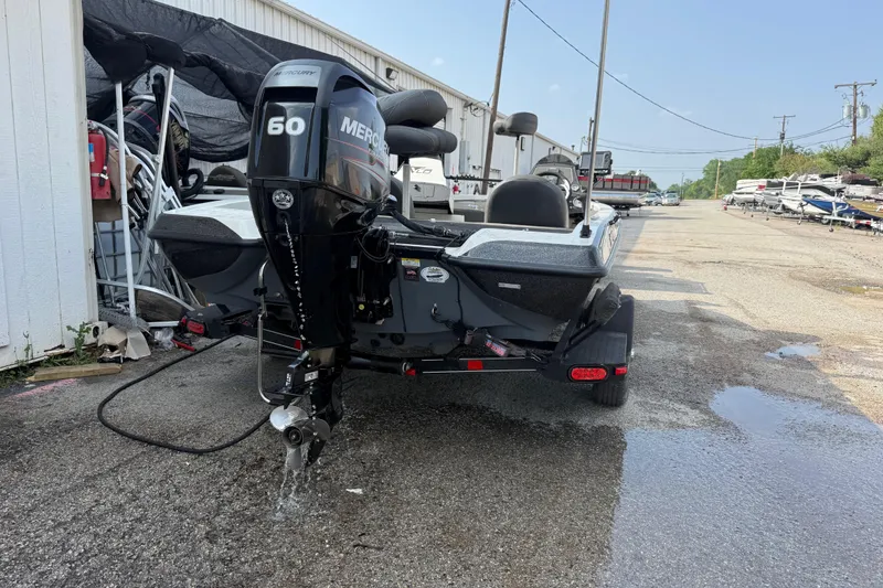 Slide: The Image of 2016 Stratos 176 VLO boat with Mercury 60 engine in a marina setting. - 8