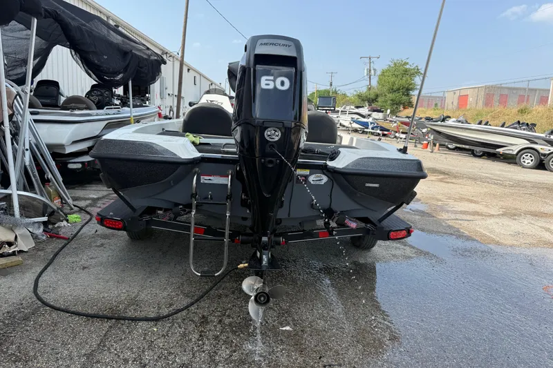 Slide: The Image of Rear view of a 2016 Stratos 176 VLO boat with a Mercury 60 engine. - 9