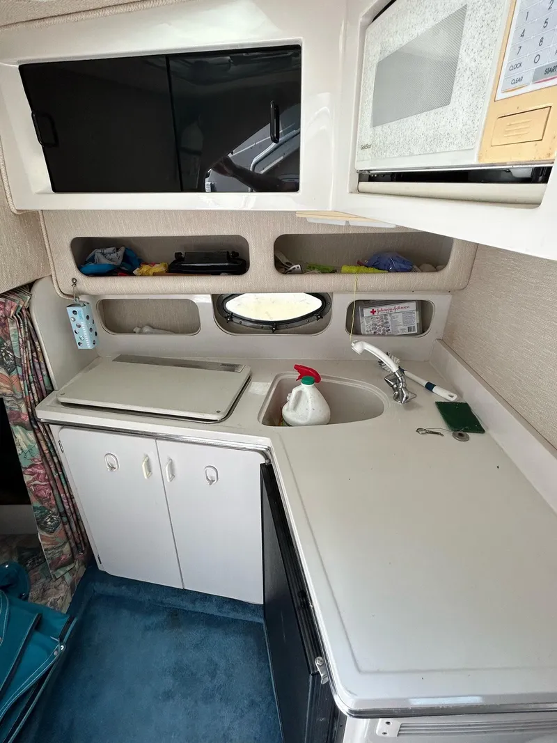 Slide: The Image of Kitchen area in a 1995 Chaparral Signature 310 boat. - 12