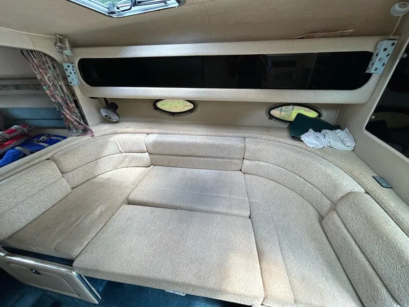 Slide: The Image of Interior of 1995 Chaparral Signature 310 boat with cushioned seating. - 13