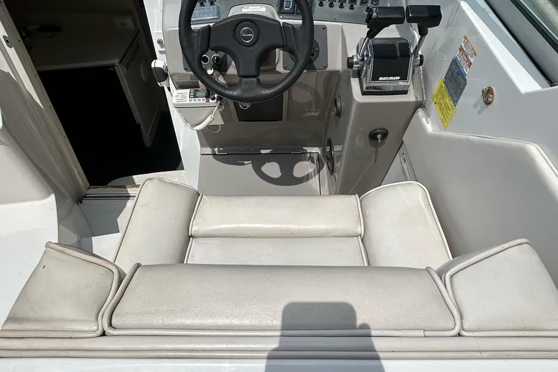 Slide: The Image of Interior of a 1995 Chaparral Signature 310 boat with helm station. - 17