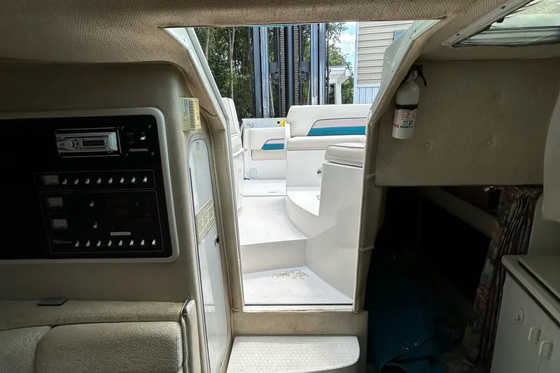 Slide: The Image of Interior of a 1995 Chaparral Signature 310 boat with seating area. - 18