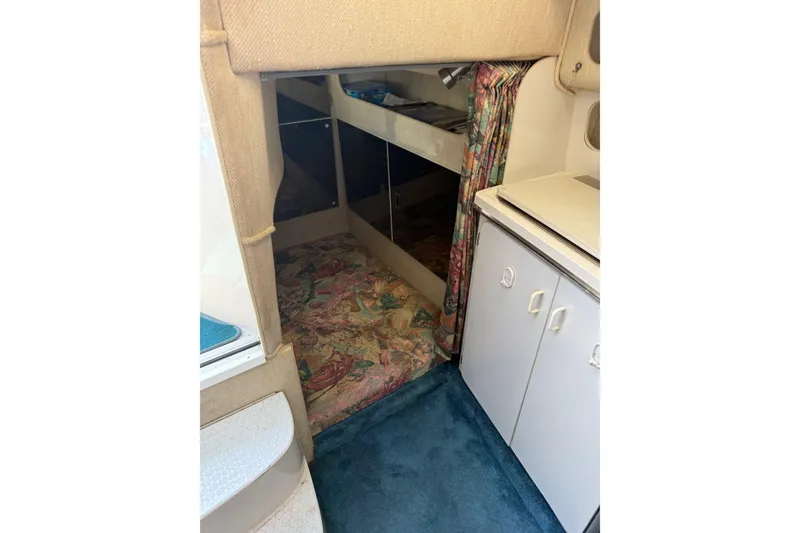 Slide: The Image of Interior of 1995 Chaparral Signature 310 boat with cabin and storage. - 23