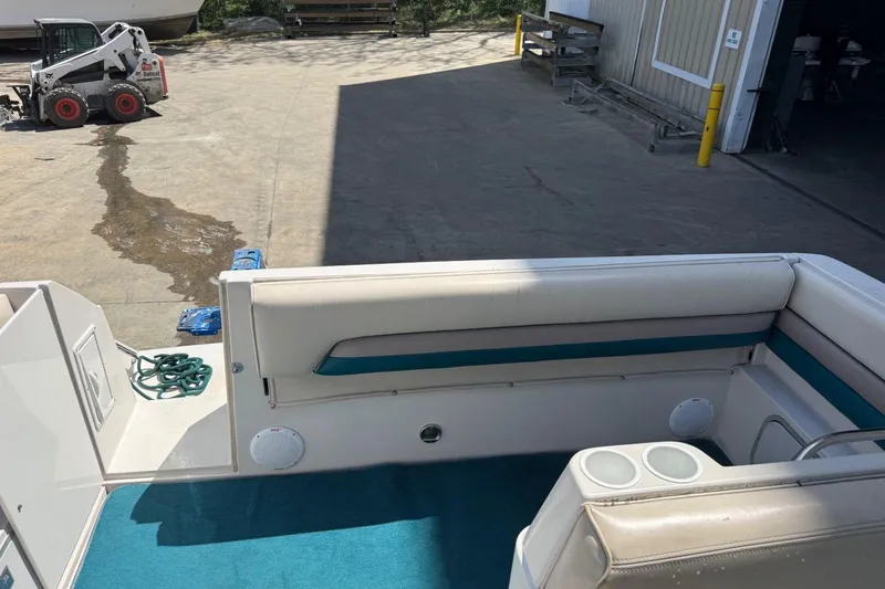 Slide: The Image of 1995 Chaparral Signature 310 boat interior with seating and cup holders. - 6