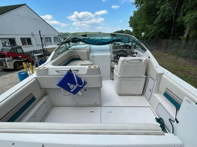 Slide: The Image of Interior of a 1995 Chaparral Signature 310 boat, featuring seating and helm. - 7