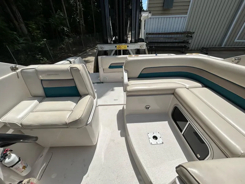 Slide: The Image of Interior of a 1995 Chaparral Signature 310 boat with seating area. - 8