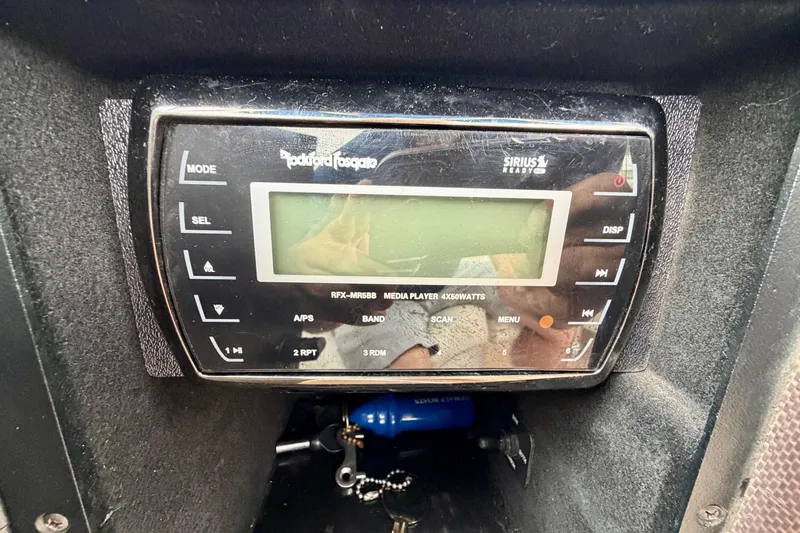 Slide: The Image of Rockford Fosgate media player in 2014 Cobalt 24SD WSS boat dashboard. - 17