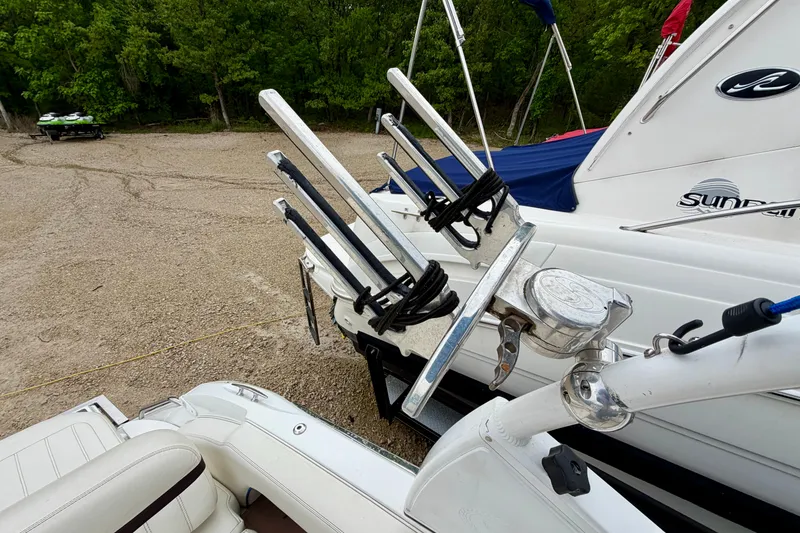 Slide: The Image of 2014 Cobalt 24SD WSS boat with wakeboard racks on a sandy shore. - 21