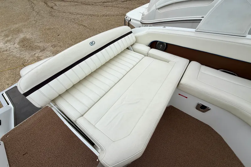 Slide: The Image of 2014 Cobalt 24SD WSS boat with white leather seating and brown accents. - 6