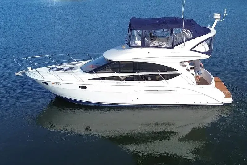 The Image of 2007 Meridan 391 yacht on calm water, featuring sleek design and spacious upper deck. - 0