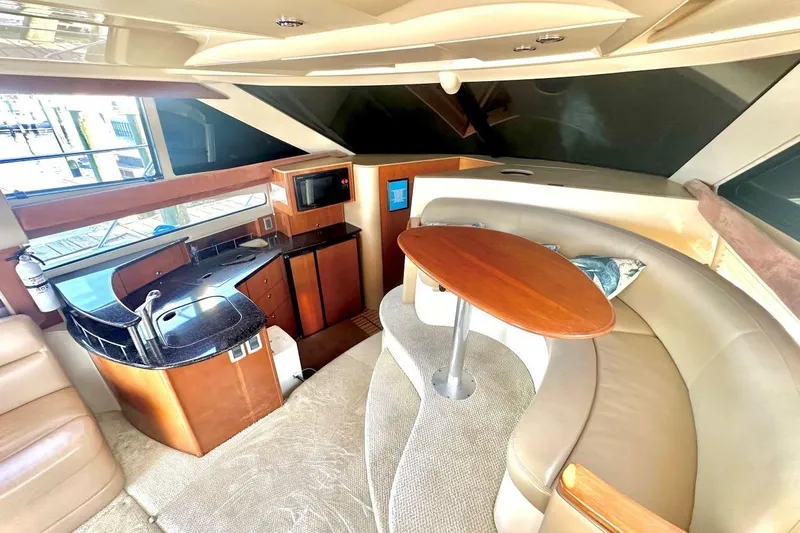 Slide: The Image of Luxurious interior of a 2007 Meridan 391 yacht featuring a modern kitchen and cozy seating area. - 10