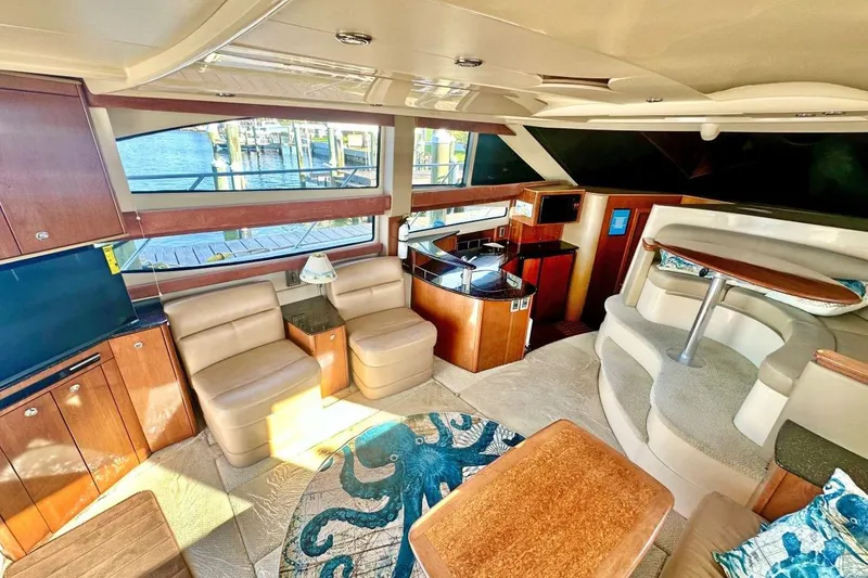 Slide: The Image of Luxurious interior of a 2007 Meridan 391 yacht with elegant seating and modern amenities. - 13