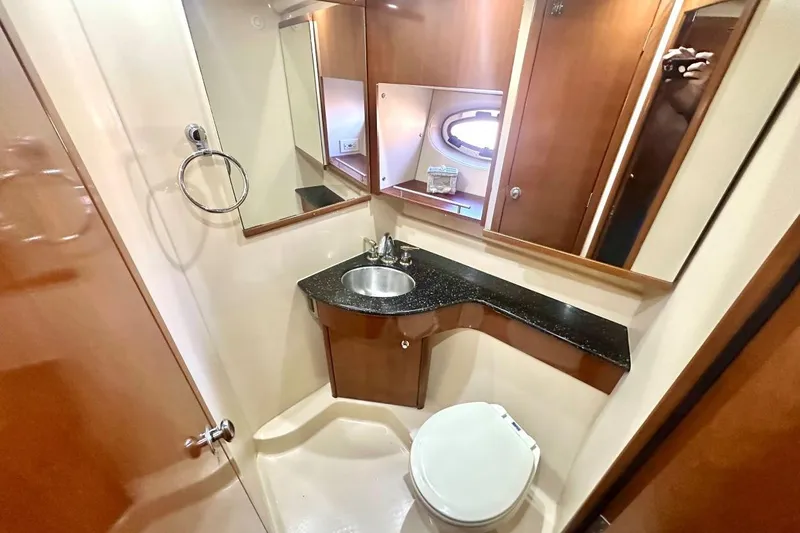 Slide: The Image of Luxurious bathroom in 2007 Meridan 391 yacht with modern fixtures and elegant wood cabinetry. - 14