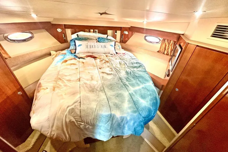 Slide: The Image of Luxurious cabin interior of 2007 Meridan 391 yacht with cozy bed and nautical decor. - 18