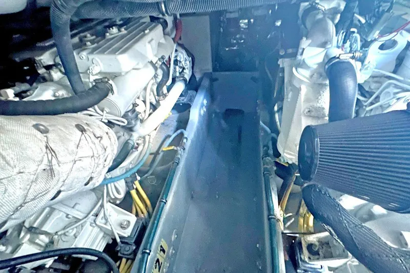 Slide: The Image of Engine compartment of a 2007 Meridan 391 boat, showcasing mechanical components and hoses. - 19