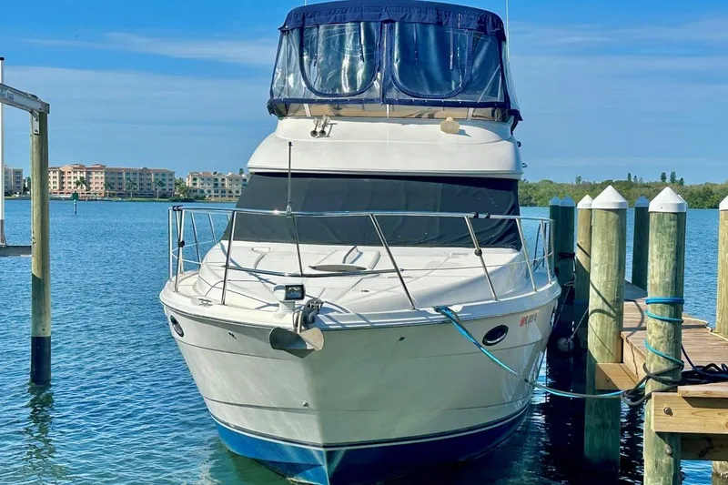 Slide: The Image of 2007 Meridan 391 yacht docked at marina, clear blue water, sunny day. - 3