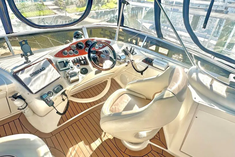 Slide: The Image of Luxurious 2007 Meridan 391 yacht cockpit with advanced navigation controls and plush seating. - 6