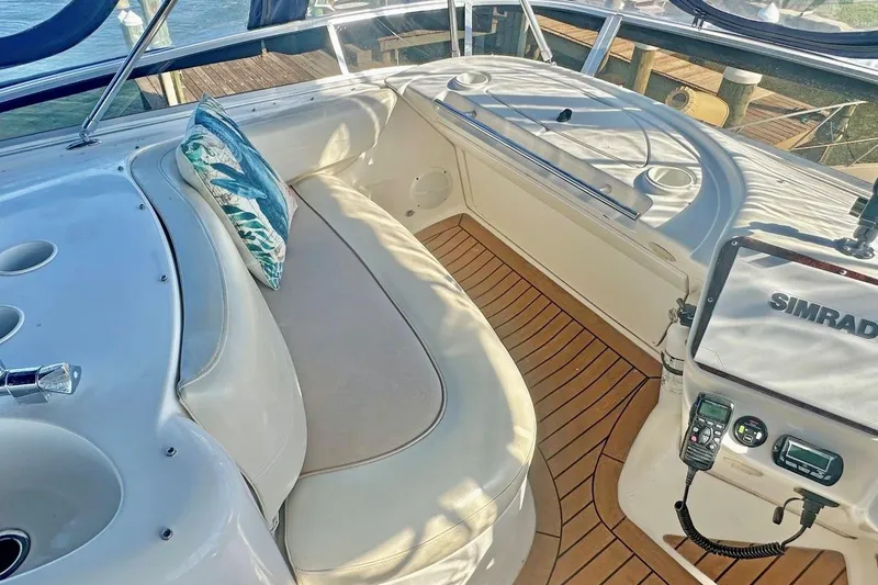 Slide: The Image of Luxurious 2007 Meridan 391 yacht interior with cushioned seating and navigation equipment. - 7
