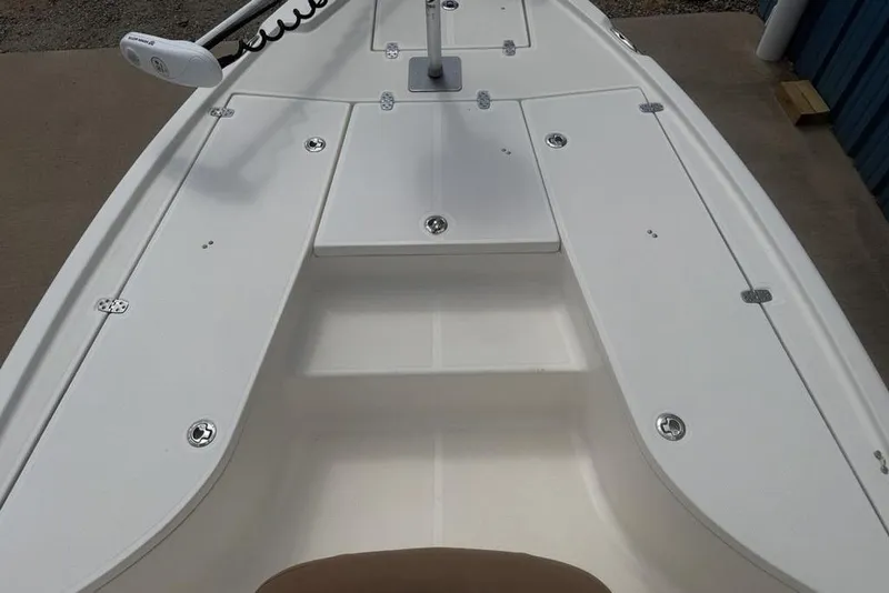 Slide: The Image of 2021 Sea Born FX21 Bay boat deck with storage compartments and trolling motor. - 14
