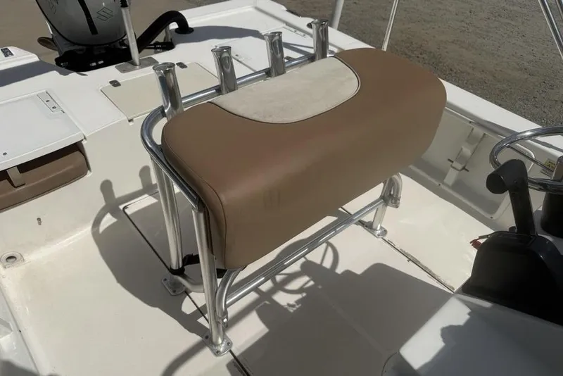 Slide: The Image of 2021 Sea Born FX21 Bay boat interior with cushioned seating and steering console. - 20