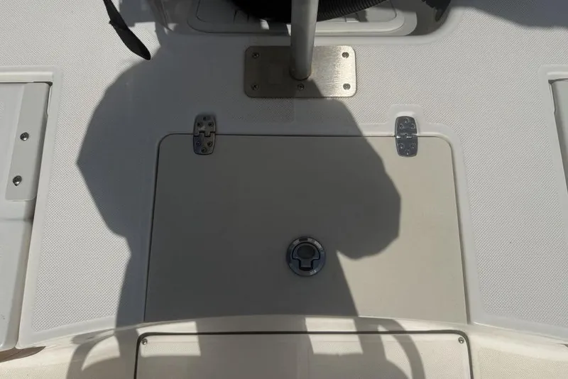 Slide: The Image of 2021 Sea Born FX21 Bay boat deck with storage hatch and latch. - 25