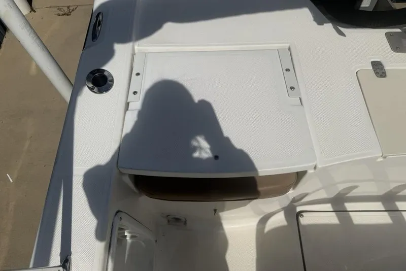 Slide: The Image of 2021 Sea Born FX21 Bay boat deck with shadow and hatch detail. - 28