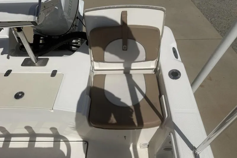Slide: The Image of 2021 Sea Born FX21 Bay boat seat and deck, featuring tan and white upholstery. - 29