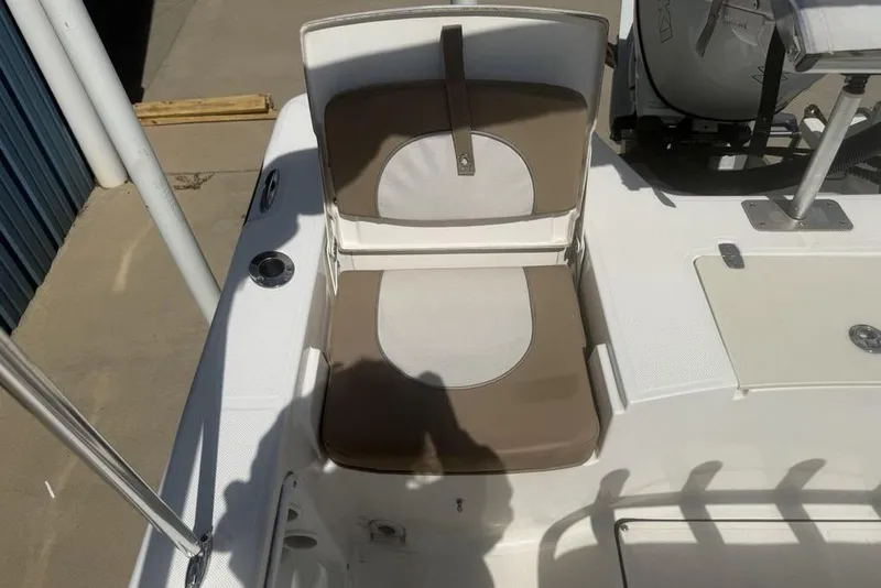 Slide: The Image of 2021 Sea Born FX21 Bay boat seat with brown and white cushions. - 30
