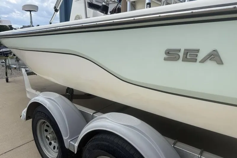Slide: The Image of 2021 Sea Born FX21 Bay boat on trailer, side view. - 5